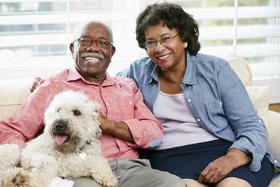 Couple smiling with dog